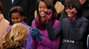 Michelle Obama (right) and her daughters, Malia (center) and Sasha, cheer as Beyoncé returns to her seat after singing the 'Star-Spangled Banner' after the swearing-in of U.S. President Barack Obama in Washington, Jan. 21, 2013. (Reuters/Kevin Lamarque)